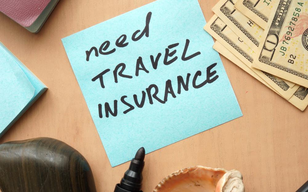 Notiz mit dem Text: Need Travel Insurance